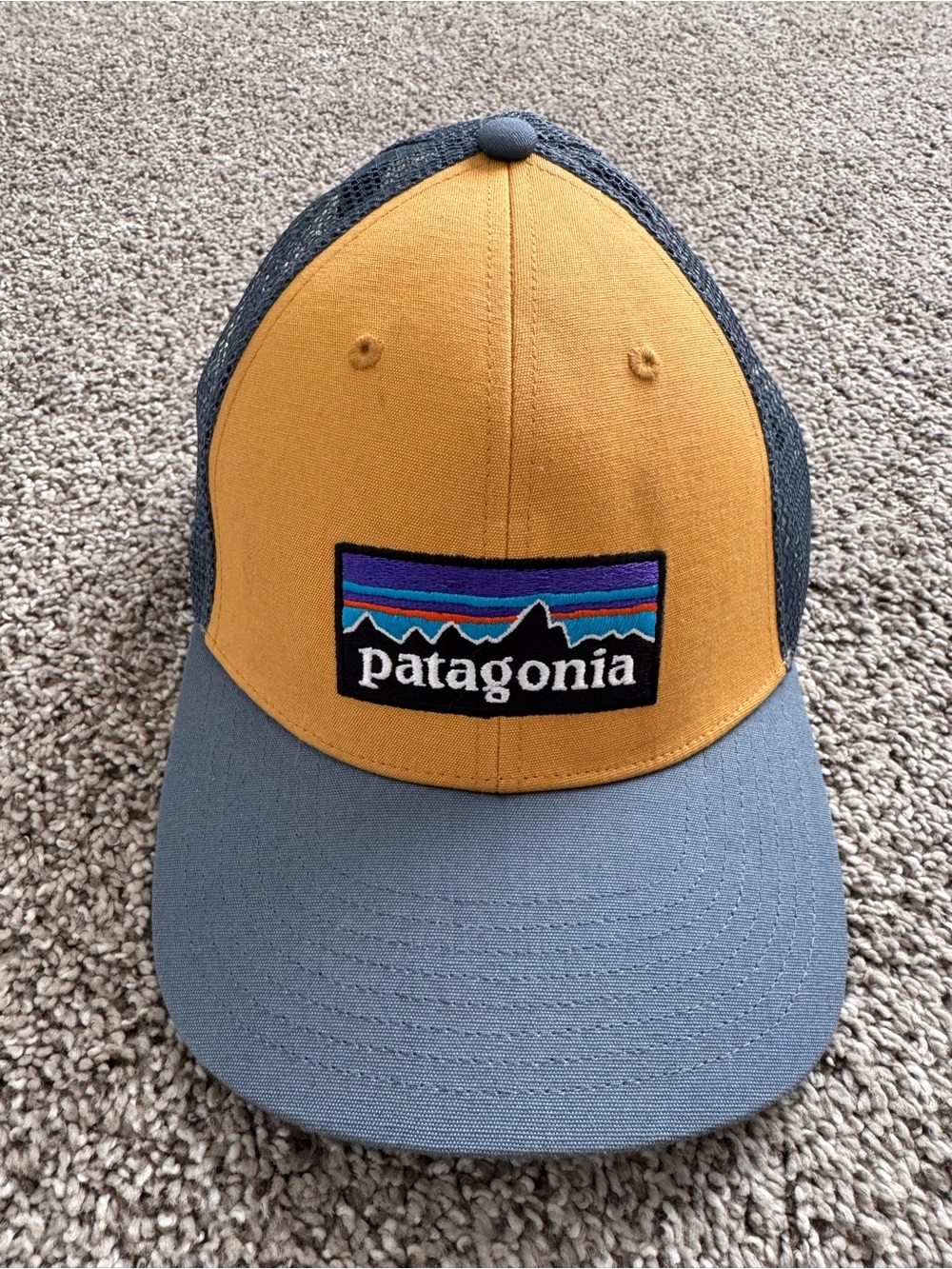 Patagonia Women’s Mustard Front with blue Bill Trucker Hat